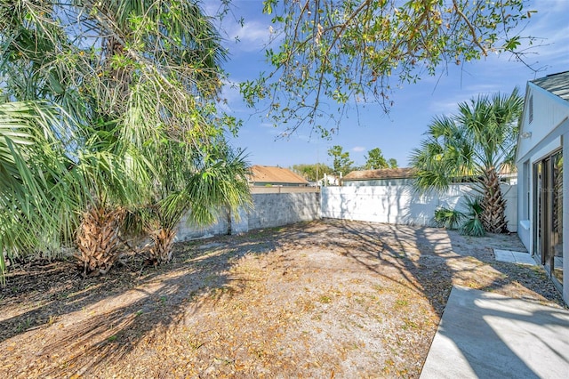 view of yard with a fenced backyard