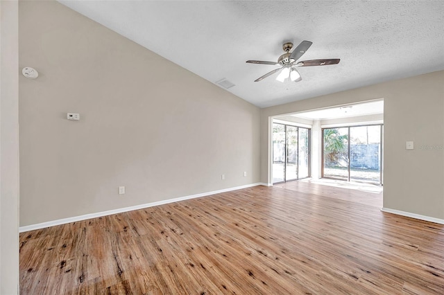 unfurnished room featuring visible vents, baseboards, light wood-style floors, and ceiling fan