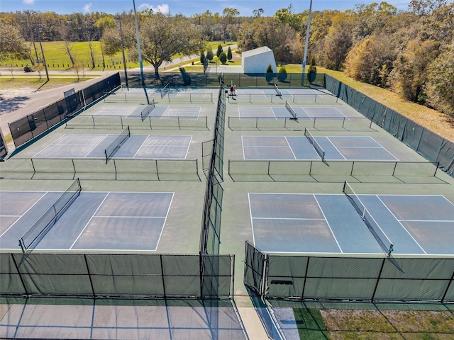 view of sport court with fence