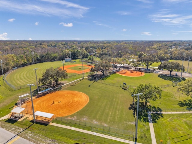 birds eye view of property featuring a wooded view