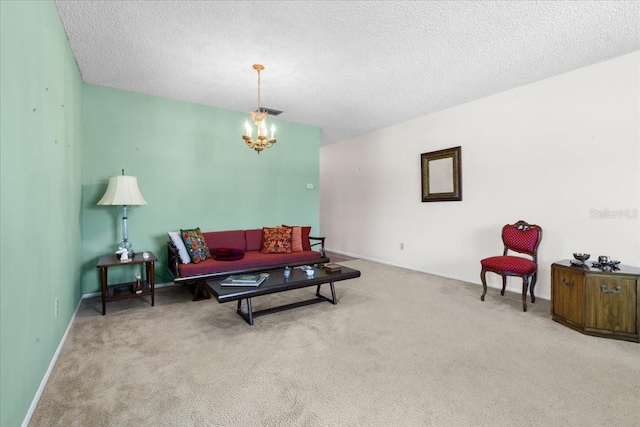 carpeted living area featuring a notable chandelier, baseboards, and a textured ceiling