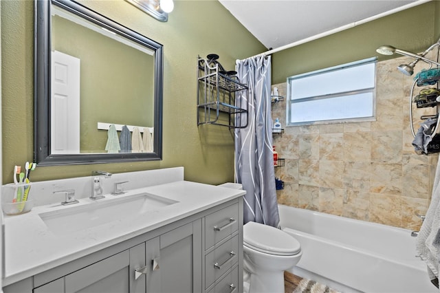 bathroom featuring vanity, shower / bath combination with curtain, and toilet