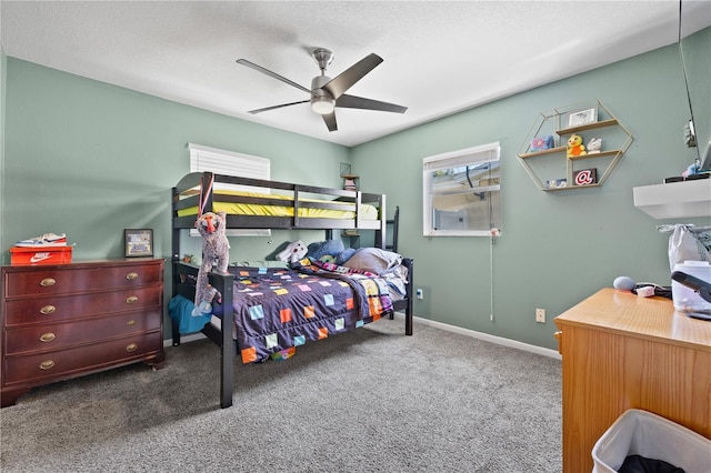 bedroom with a ceiling fan, carpet, and baseboards