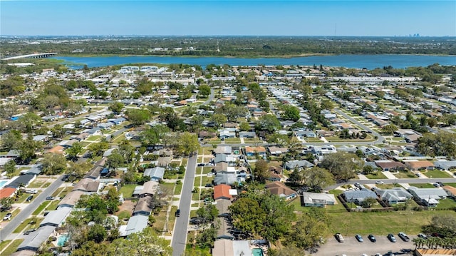 bird's eye view featuring a residential view and a water view