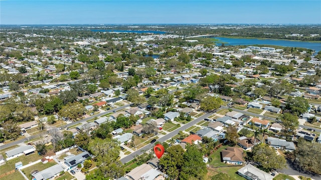 birds eye view of property with a residential view and a water view