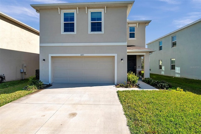 traditional-style home featuring stucco siding, concrete driveway, and an attached garage