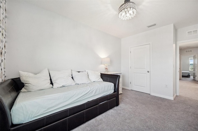 bedroom with visible vents, baseboards, and carpet flooring