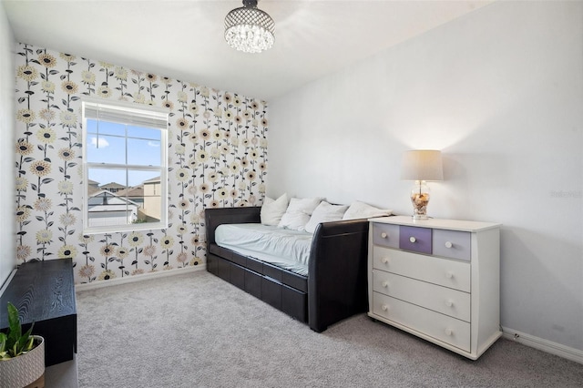 bedroom featuring a notable chandelier, carpet flooring, wallpapered walls, and baseboards