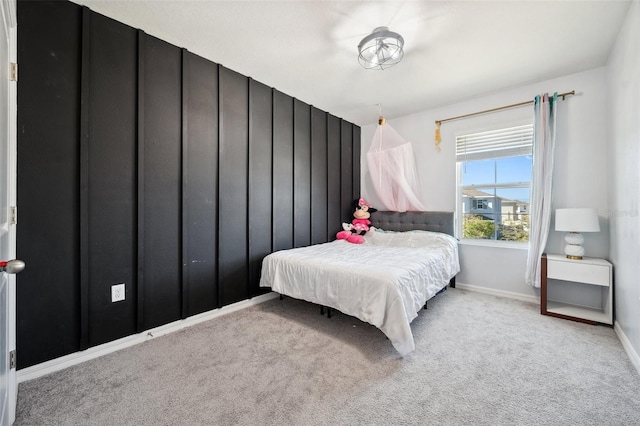 carpeted bedroom with baseboards