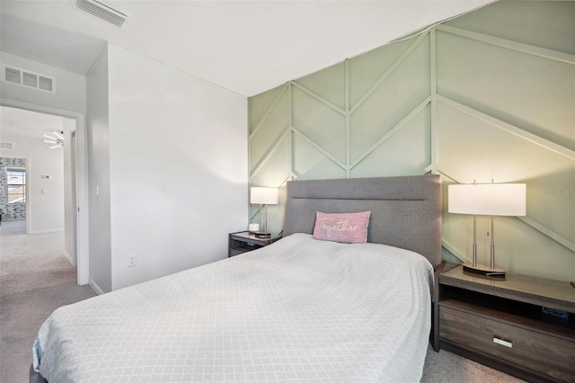 carpeted bedroom featuring baseboards and visible vents