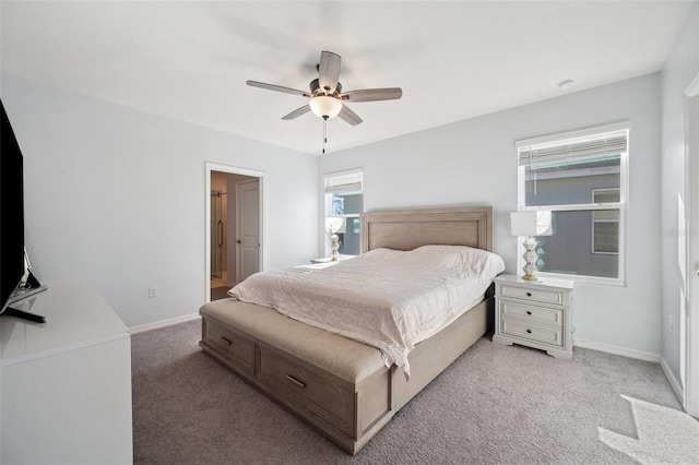 bedroom featuring light colored carpet, baseboards, and ceiling fan