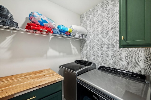 washroom with washer and clothes dryer and laundry area