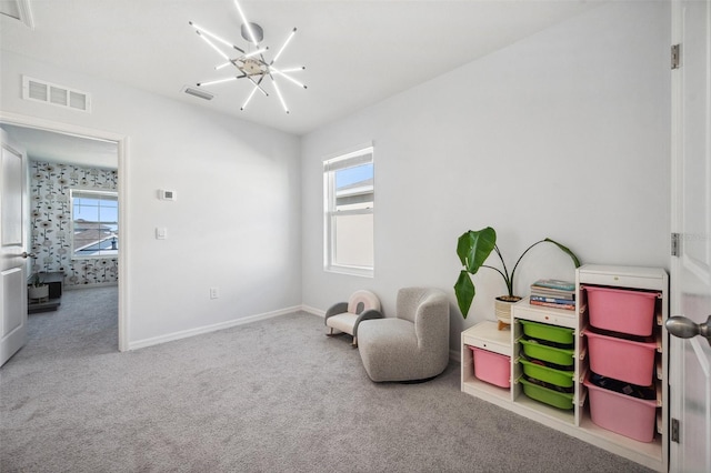 playroom featuring a notable chandelier, visible vents, baseboards, and carpet floors