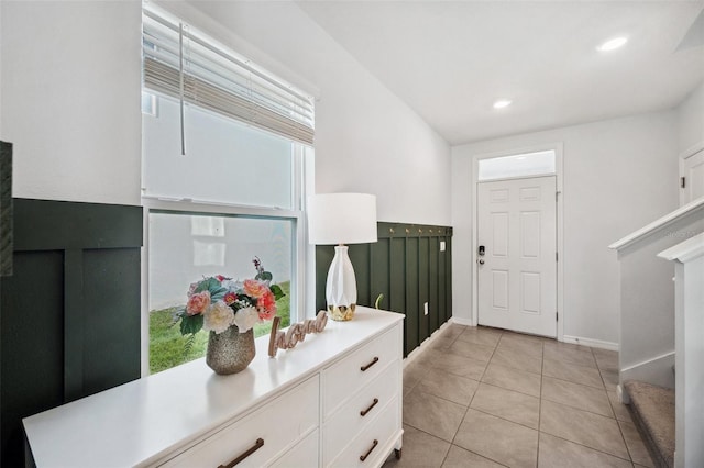 foyer featuring light tile patterned floors, recessed lighting, and baseboards