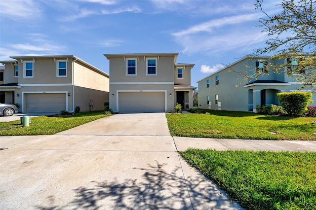 view of front facade with concrete driveway, an attached garage, a front lawn, and stucco siding