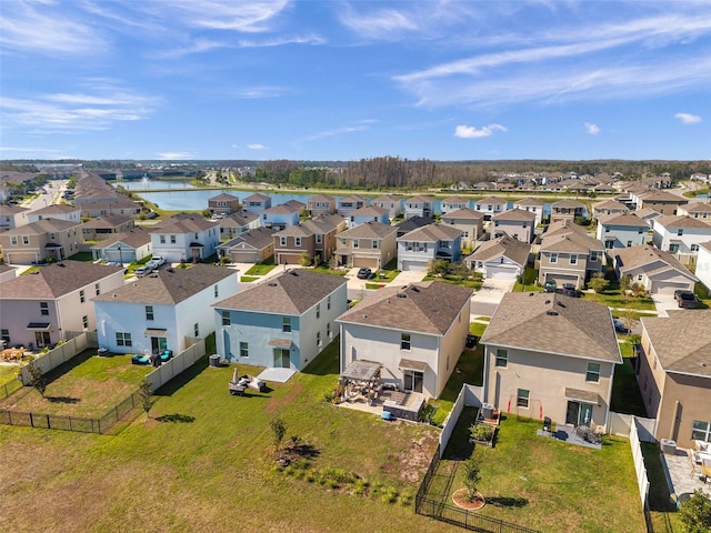 bird's eye view with a residential view and a water view