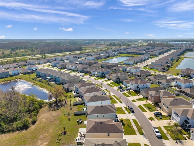 birds eye view of property with a residential view and a water view