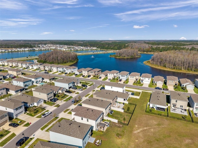 bird's eye view with a residential view and a water view