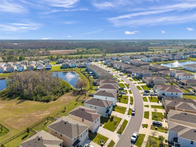 bird's eye view with a residential view and a water view