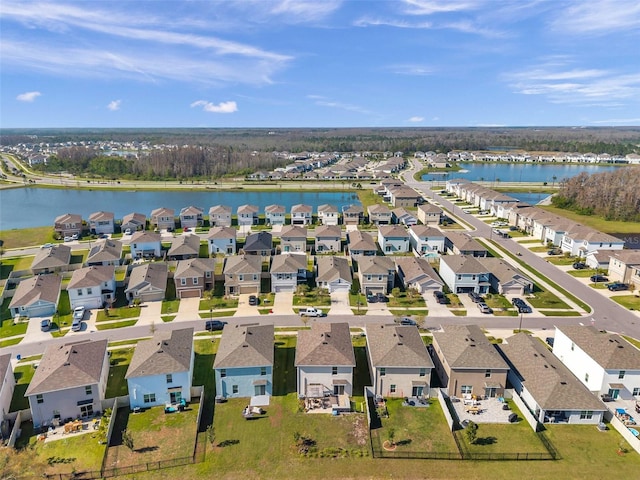 birds eye view of property featuring a residential view and a water view