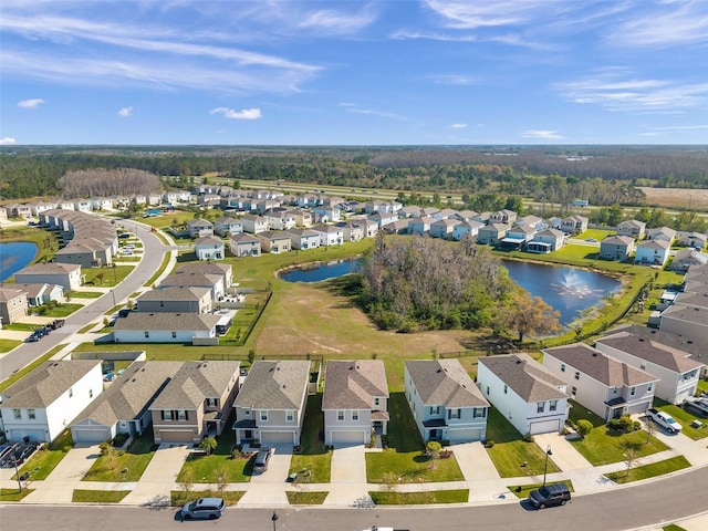 aerial view featuring a residential view and a water view