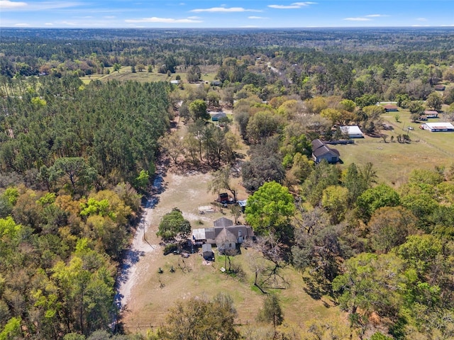 aerial view featuring a wooded view