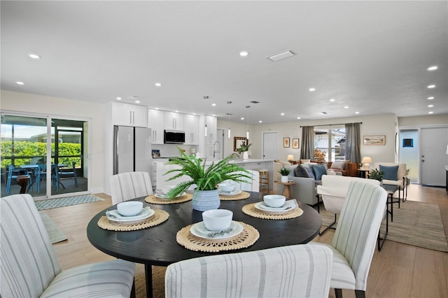2008 41st St W, Bradenton, FL 34205 - dining room with light wood finished floors and recessed lighting