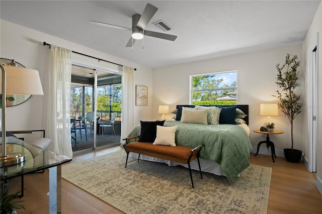 2008 41st St W, Bradenton, FL 34205 - bedroom with access to exterior, multiple windows, wood finished floors, and visible vents
