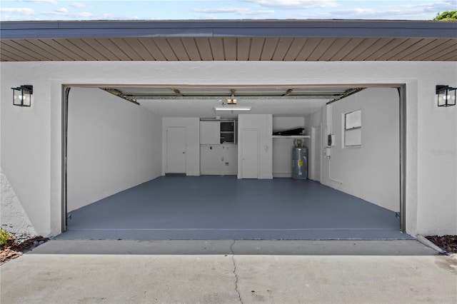 2008 41st St W, Bradenton, FL 34205 - garage with electric water heater and driveway