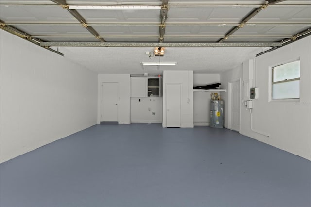 2008 41st St W, Bradenton, FL 34205 - garage featuring a garage door opener and water heater