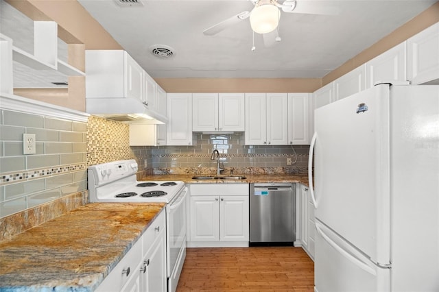 kitchen with visible vents, white appliances, white cabinetry, a ceiling fan, and a sink