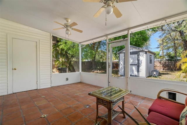 sunroom with a ceiling fan