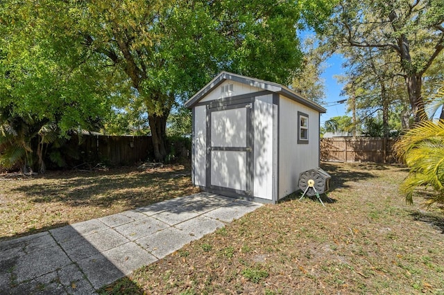 view of shed featuring a fenced backyard