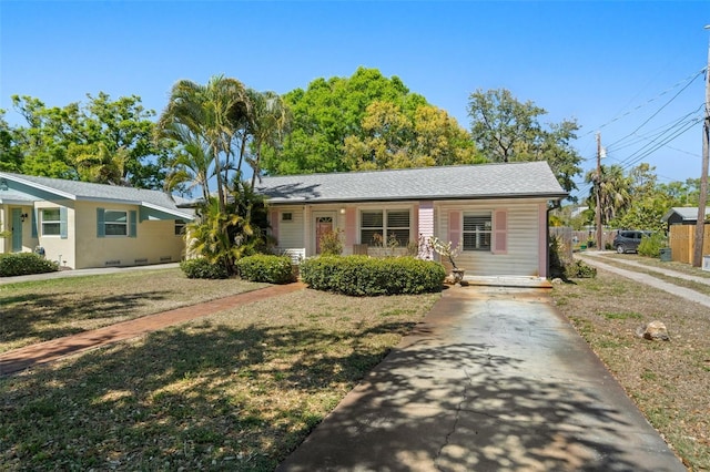 single story home featuring driveway and a front yard