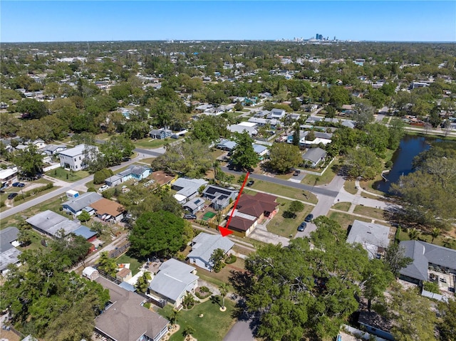 birds eye view of property featuring a residential view and a water view