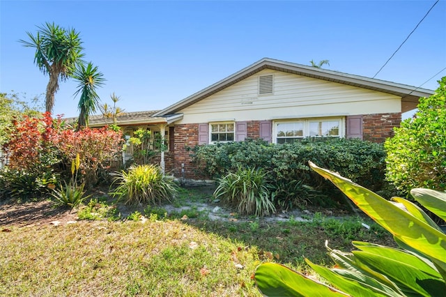 view of front of property featuring brick siding