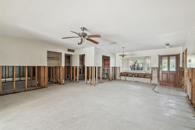 unfurnished living room with visible vents, concrete flooring, and a ceiling fan