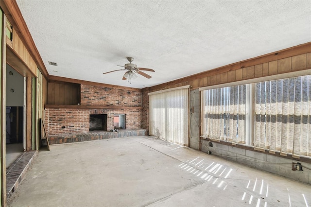 unfurnished sunroom featuring visible vents and ceiling fan