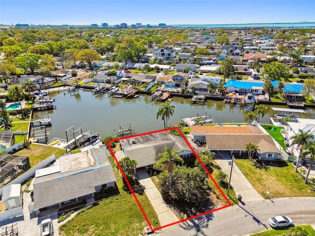 drone / aerial view featuring a residential view and a water view