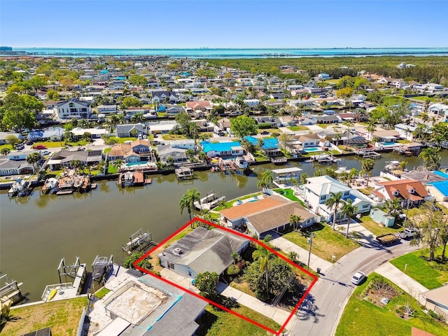 birds eye view of property with a residential view and a water view