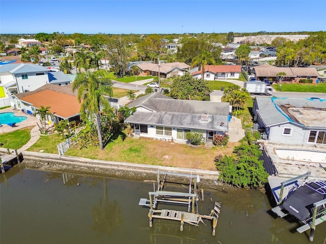 birds eye view of property featuring a residential view and a water view