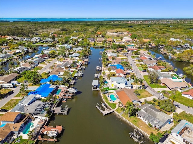 aerial view with a residential view and a water view