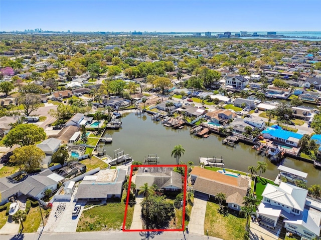 birds eye view of property featuring a residential view and a water view