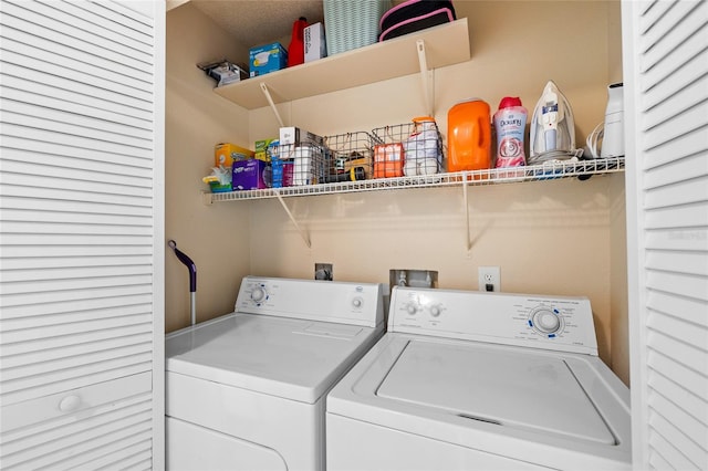 laundry room with laundry area and washing machine and dryer