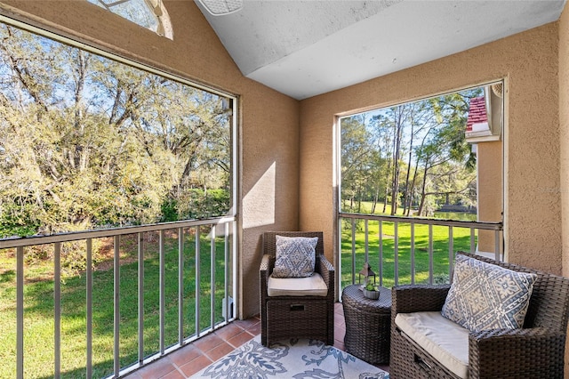 sunroom / solarium with vaulted ceiling