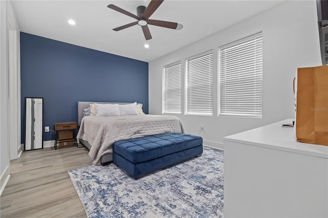 bedroom with a ceiling fan, recessed lighting, baseboards, and light wood-type flooring