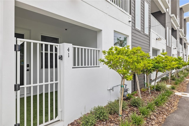 entrance to property with stucco siding