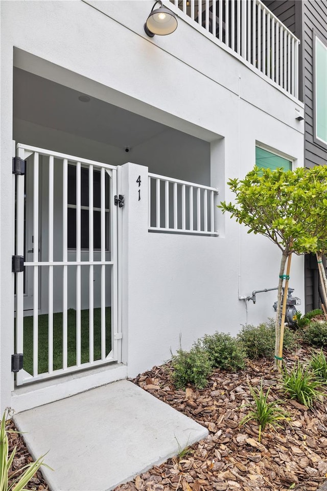 doorway to property with stucco siding