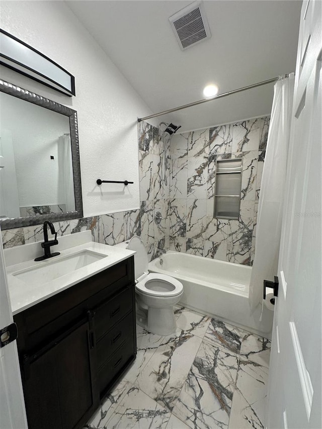 bathroom featuring vanity, visible vents, shower / bath combo, tile walls, and toilet