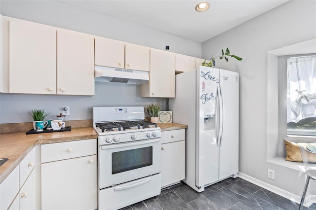 kitchen featuring marble finish floor, under cabinet range hood, white appliances, light countertops, and baseboards